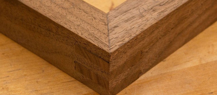 Which nifty gadget ensures those wooden trim angles meet in a flawless, snug corner embrace?