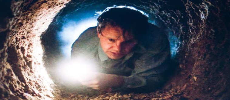 Some fellow spends an eternity chipping away with a tiny hammer just to take a filthy, aromatic soak in a sewer pipe.